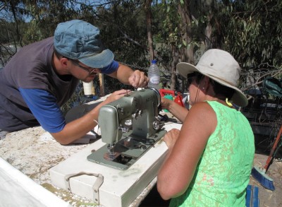 Hard working French people working on repairing the sewing machine