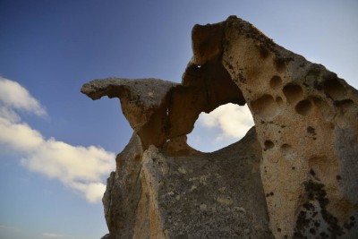 Wind, water, and sand meet rock to sculpt this at Cala Coticcio, Sardinia