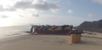 Slowly pushing their boats up the beach...I wish I had my nice camera for this event